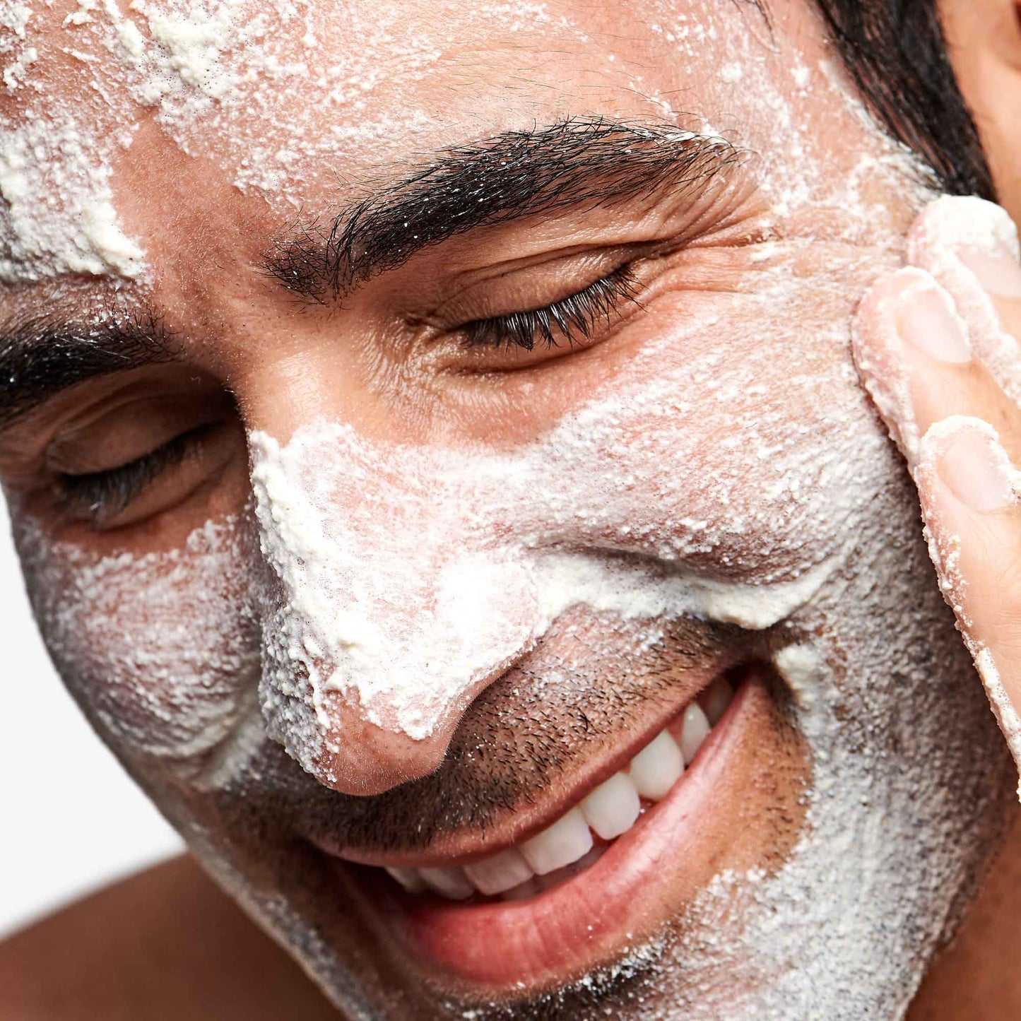 Man applying Daily Microfoliant to face