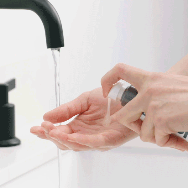 Daily Glycolic Cleanser dispensed liquid into hand