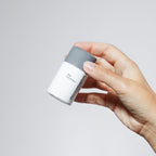 Daily Microfoliant bottle held in hand.